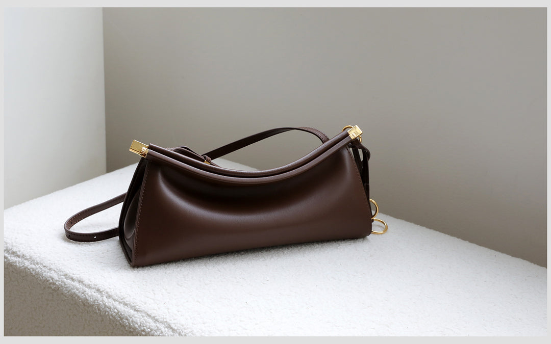 sleek leather shoulder bag with curved silhouette – ZOKSH