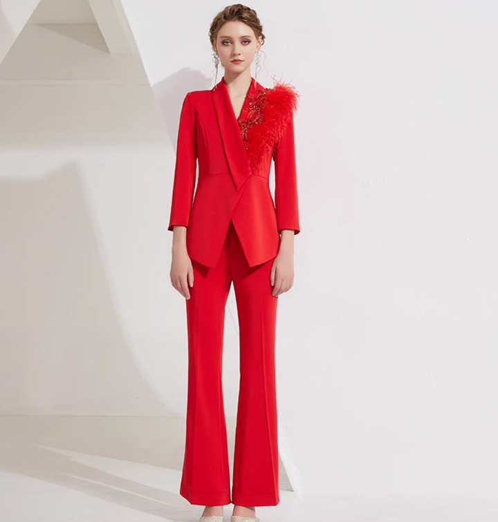 asymmetrical flare suit with feather brooch detail – CARMINE