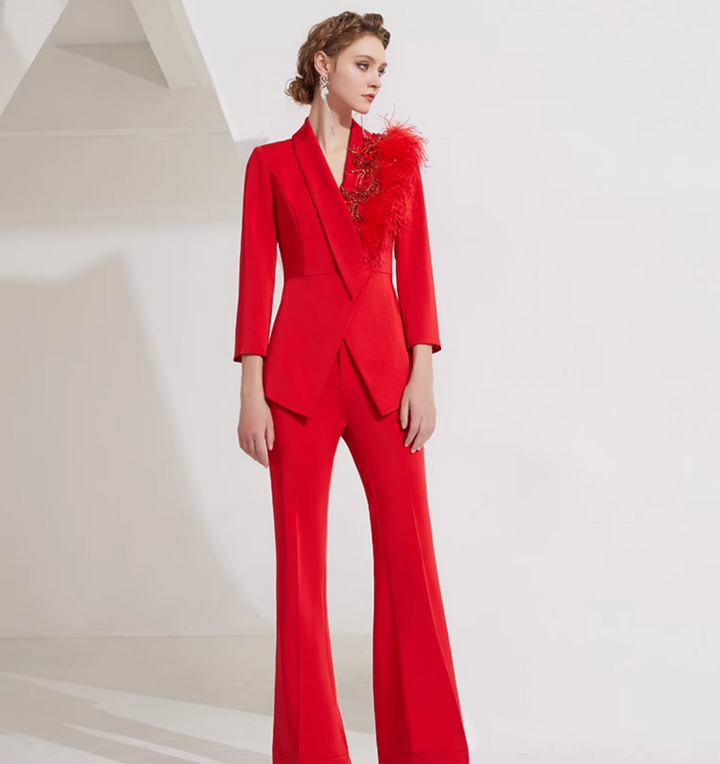 asymmetrical flare suit with feather brooch detail – CARMINE
