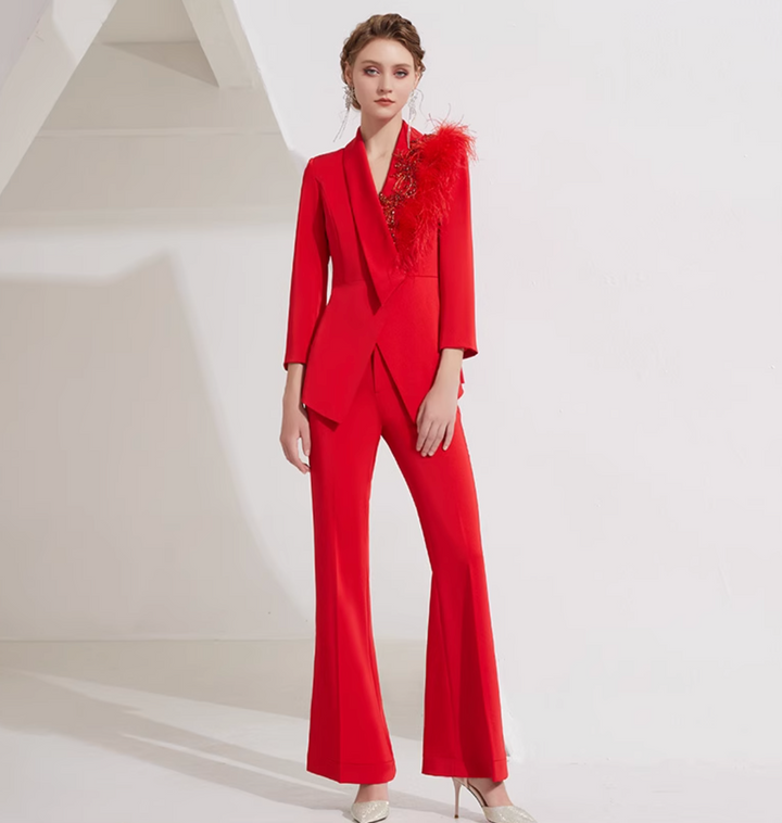 asymmetrical flare suit with feather brooch detail – CARMINE