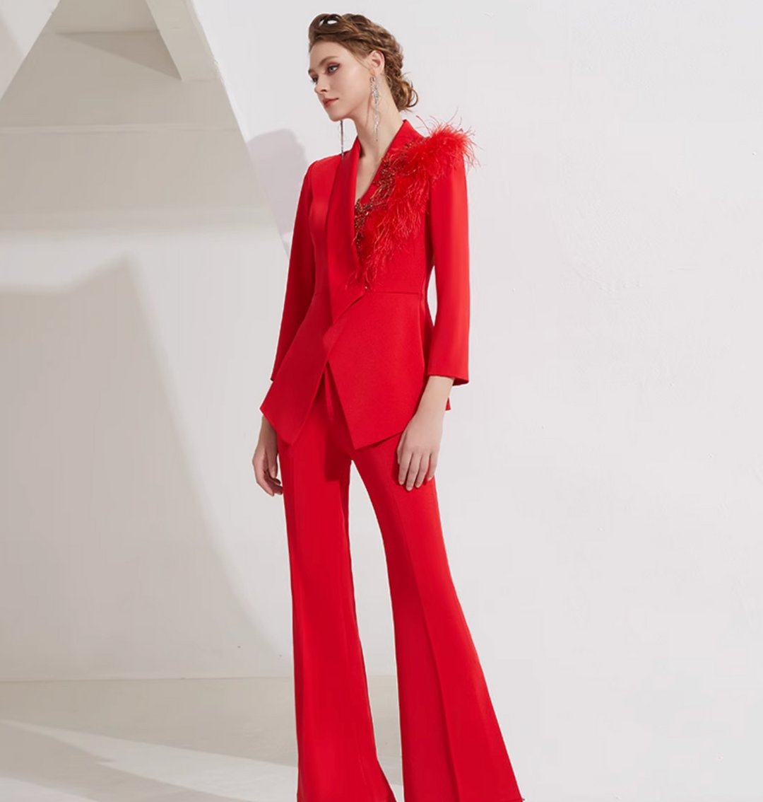 asymmetrical flare suit with feather brooch detail – CARMINE
