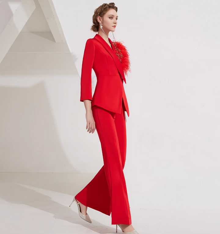 asymmetrical flare suit with feather brooch detail – CARMINE