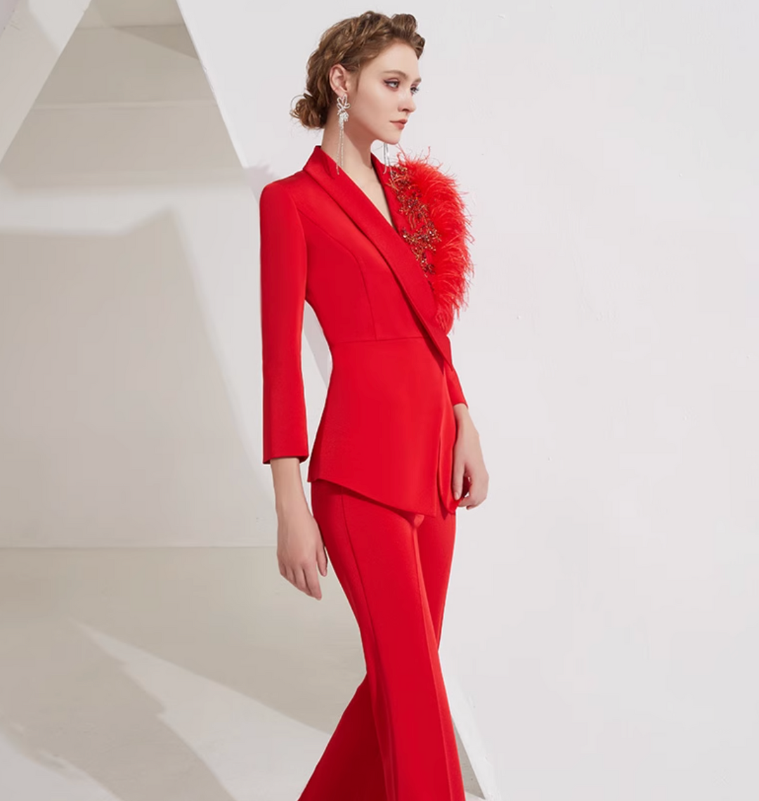 asymmetrical flare suit with feather brooch detail – CARMINE