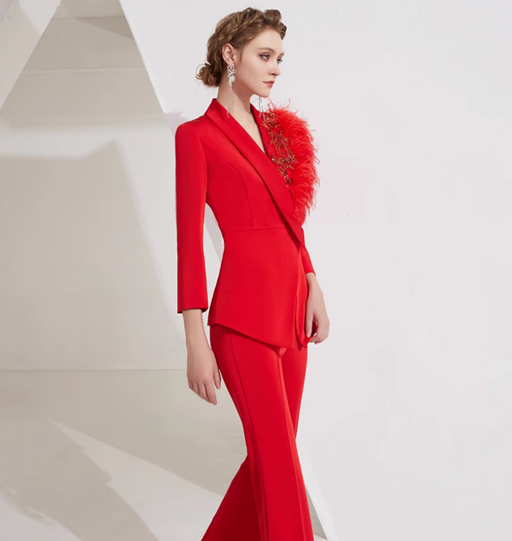 asymmetrical flare suit with feather brooch detail – CARMINE