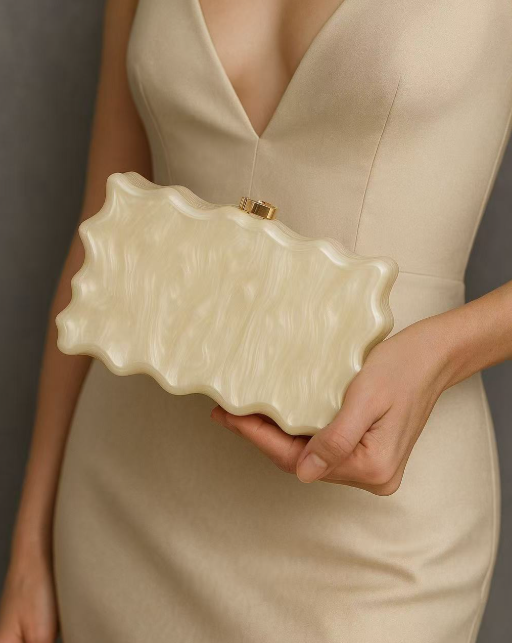 sculpted pearl-effect clutch with wave edges – ELYSIA