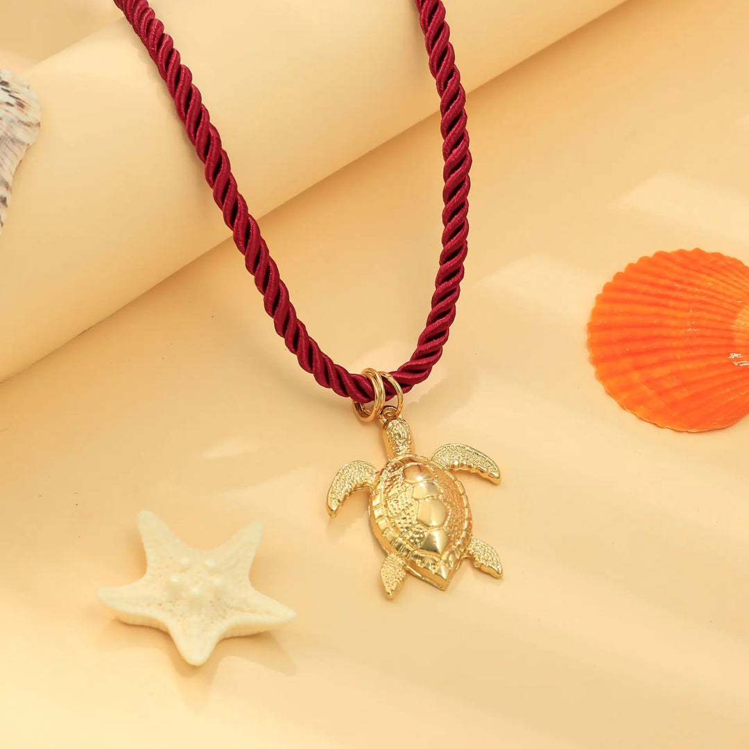 mouwloze uitlopende midi-jurk met kettingriem - CELIAV 