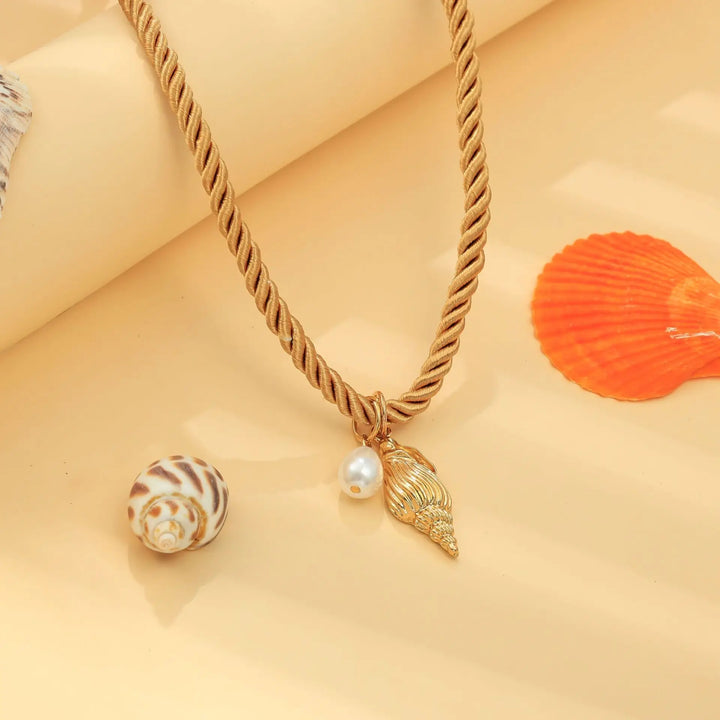 mouwloze uitlopende midi-jurk met kettingriem - CELIAV 