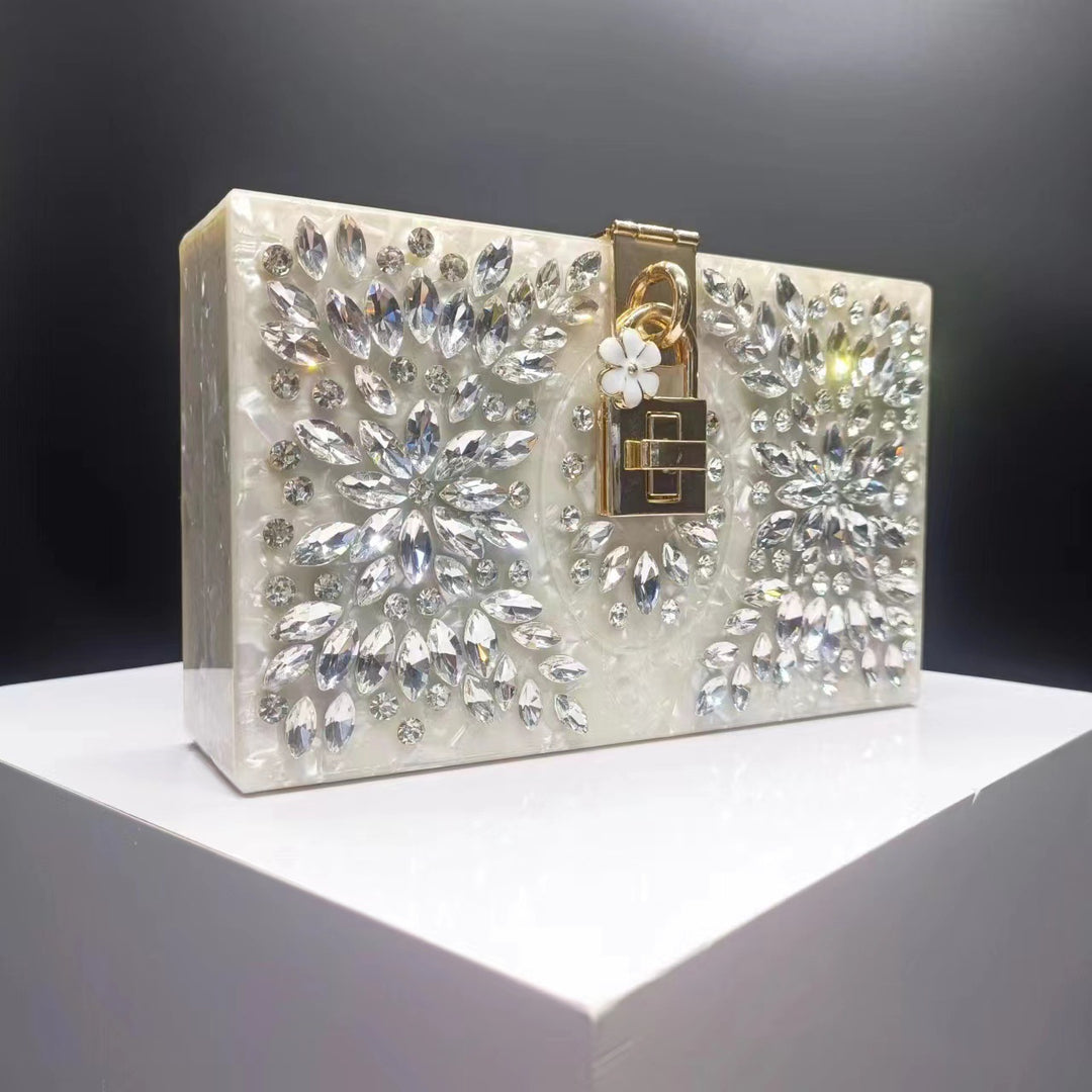crystal-embellished acrylic clutch with floral lock – ESMENU